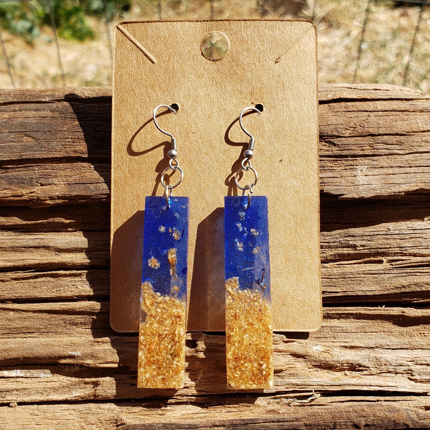 Pair of boho earrings with blue and gold design