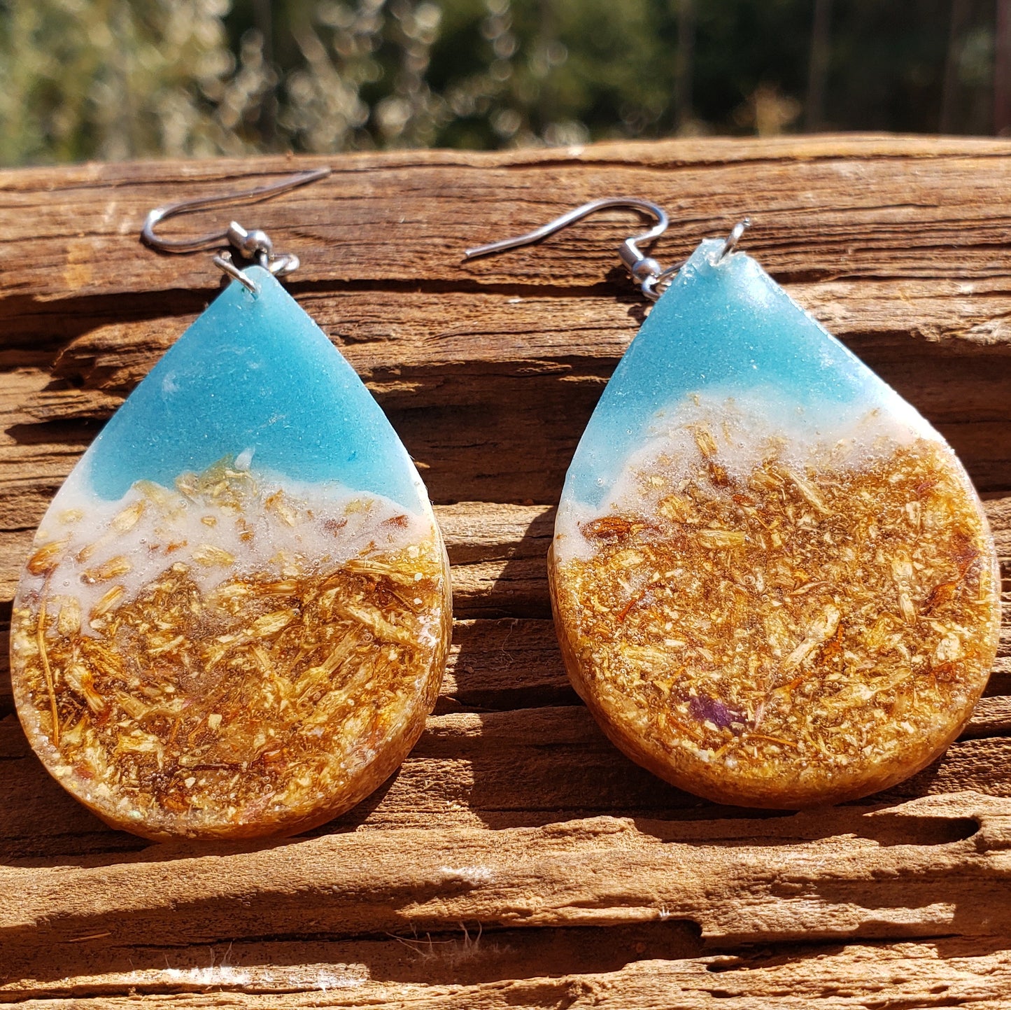 Teardrop-shaped earrings with gold and blue design ocean inspired