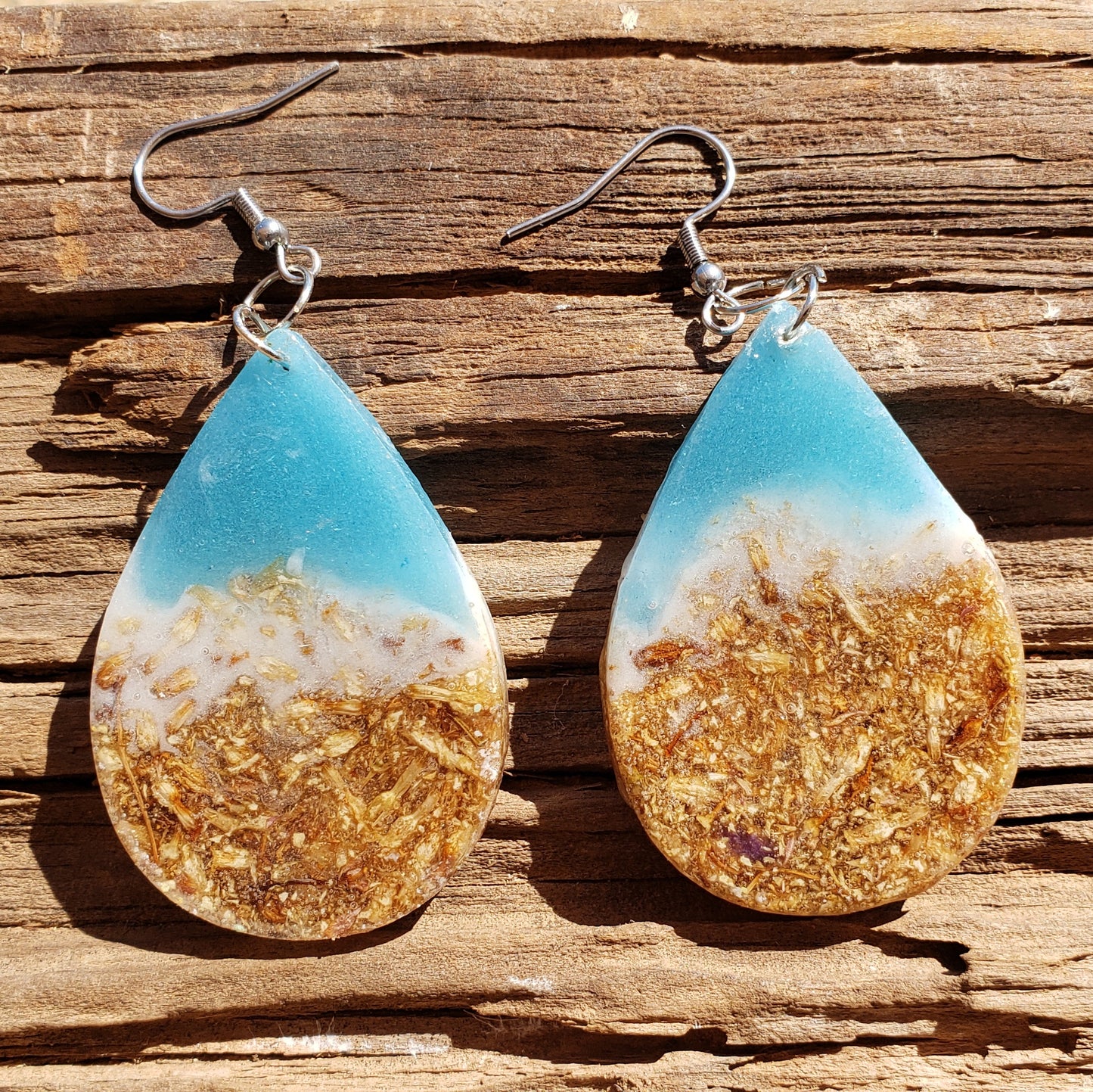 Teardrop-shaped earrings with gold and blue design ocean inspired