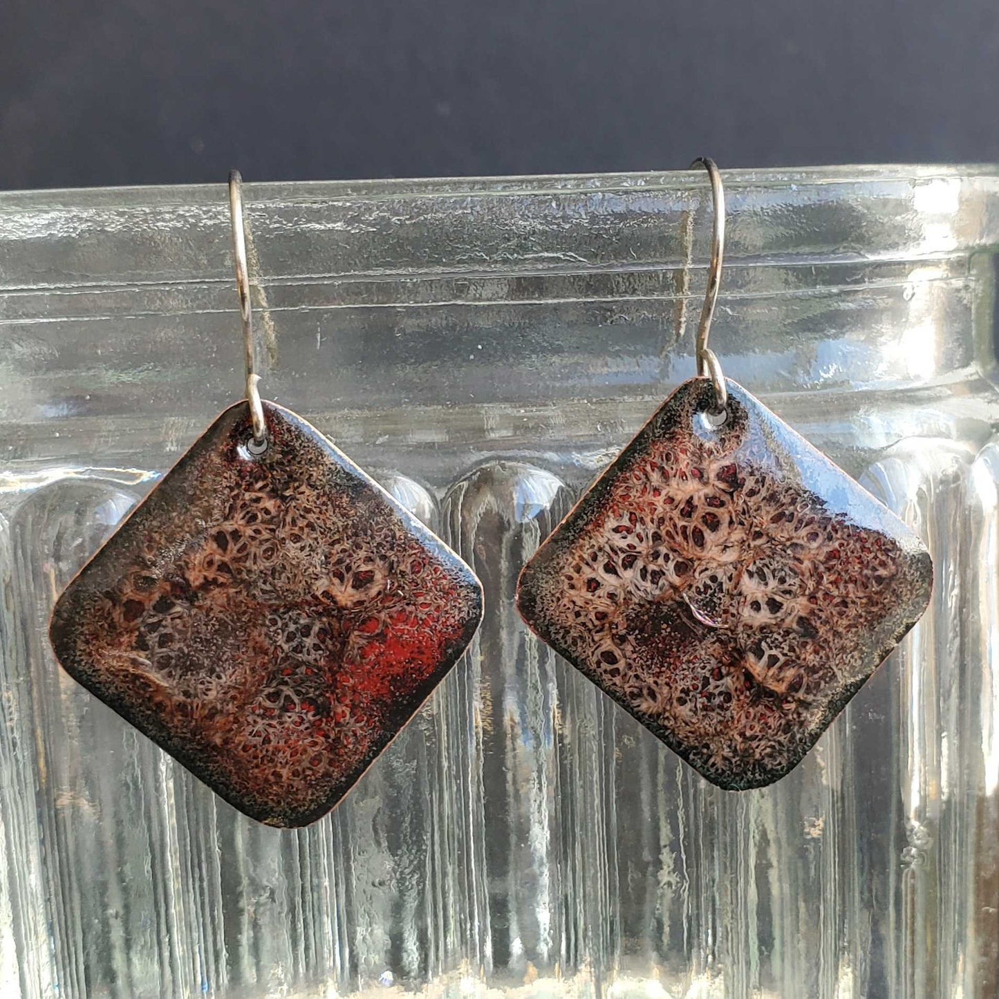 Pair of pink and red copper enamel earrings with textured surface
