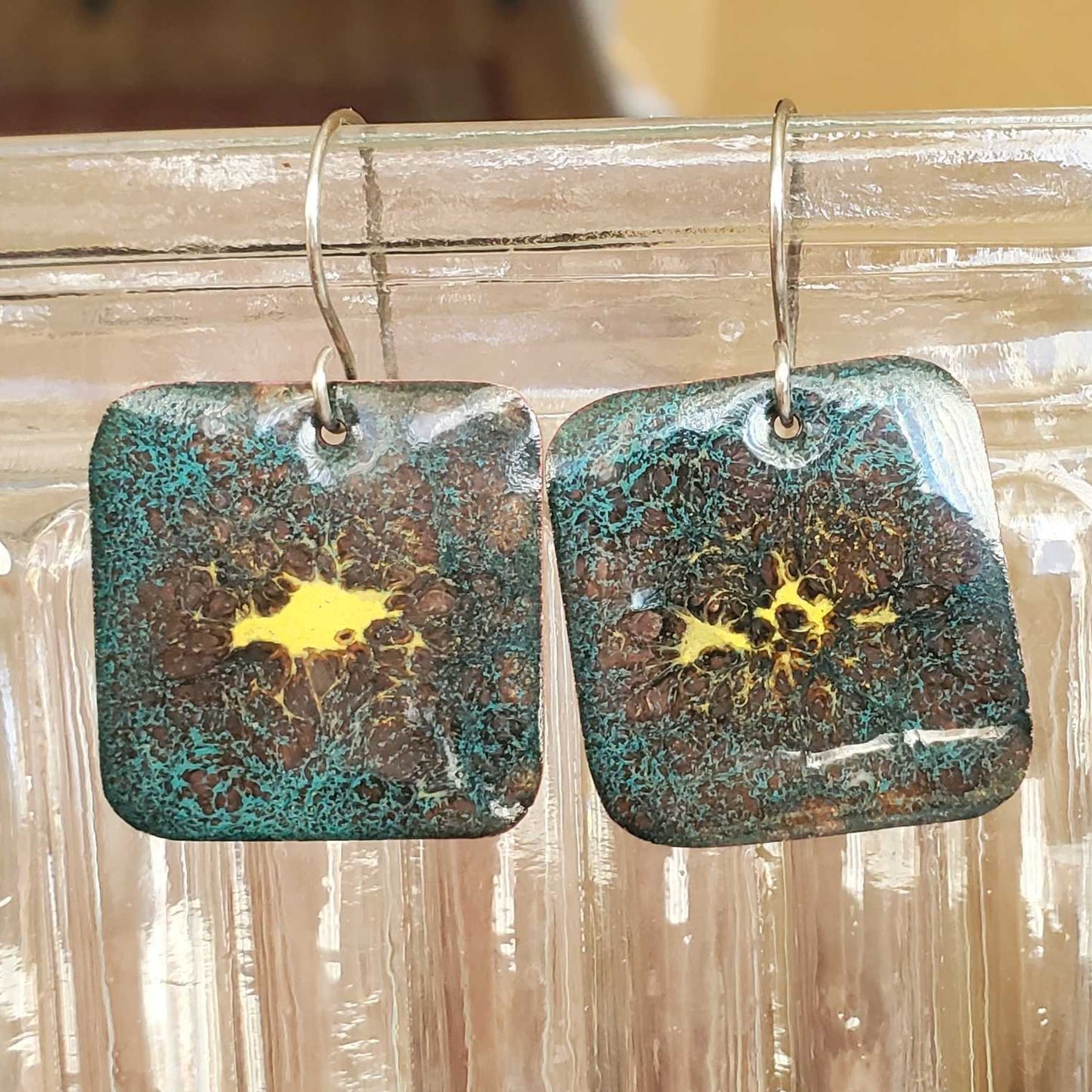 Pair of square copper enamel earrings with yellow center design