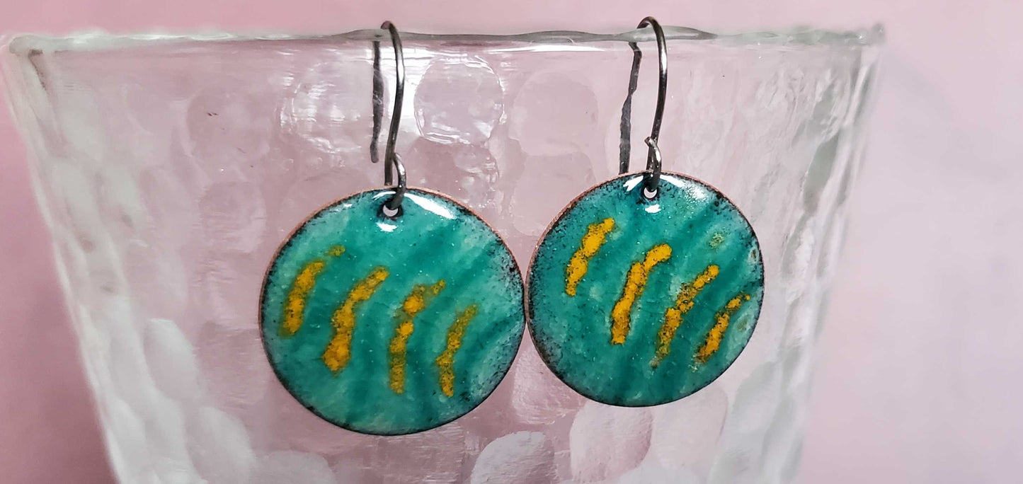 Turquoise and yellow copper enamel earrings on glass