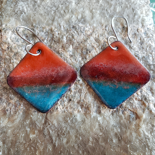 Pair of boho copper earrings with red and blue gradient