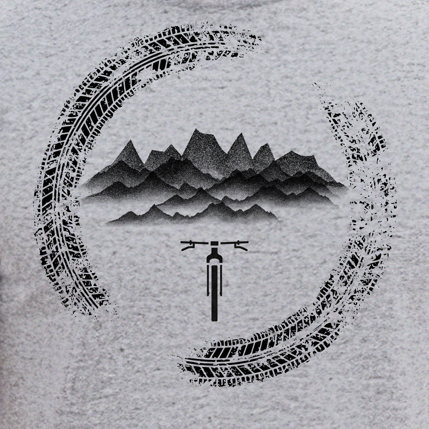 Tshirt design with tire tracks, mountains, and a bicycle on a textured gray background