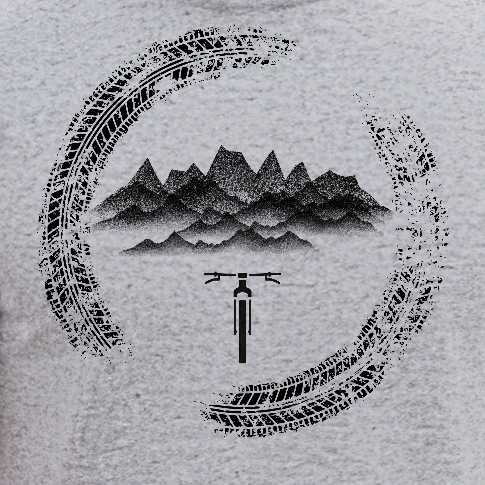 Tshirt design with tire tracks, mountains, and a bicycle on a textured gray background