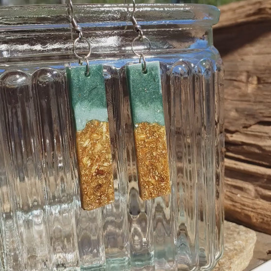 Lake inspired dangle earrings with dried flowers and teal greenish blue base color