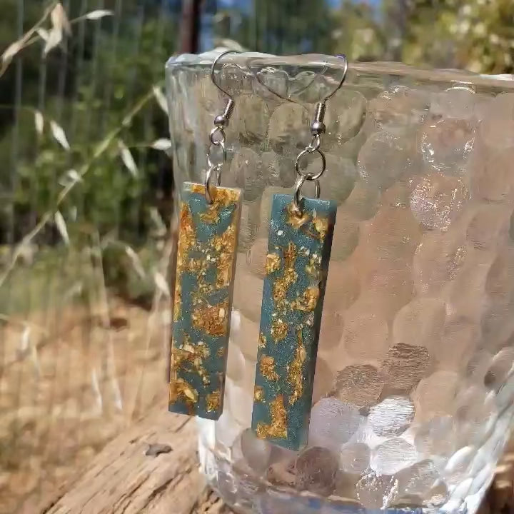 Boho dangle earrings with blue and gold pattern made from dried jasmine flowers video